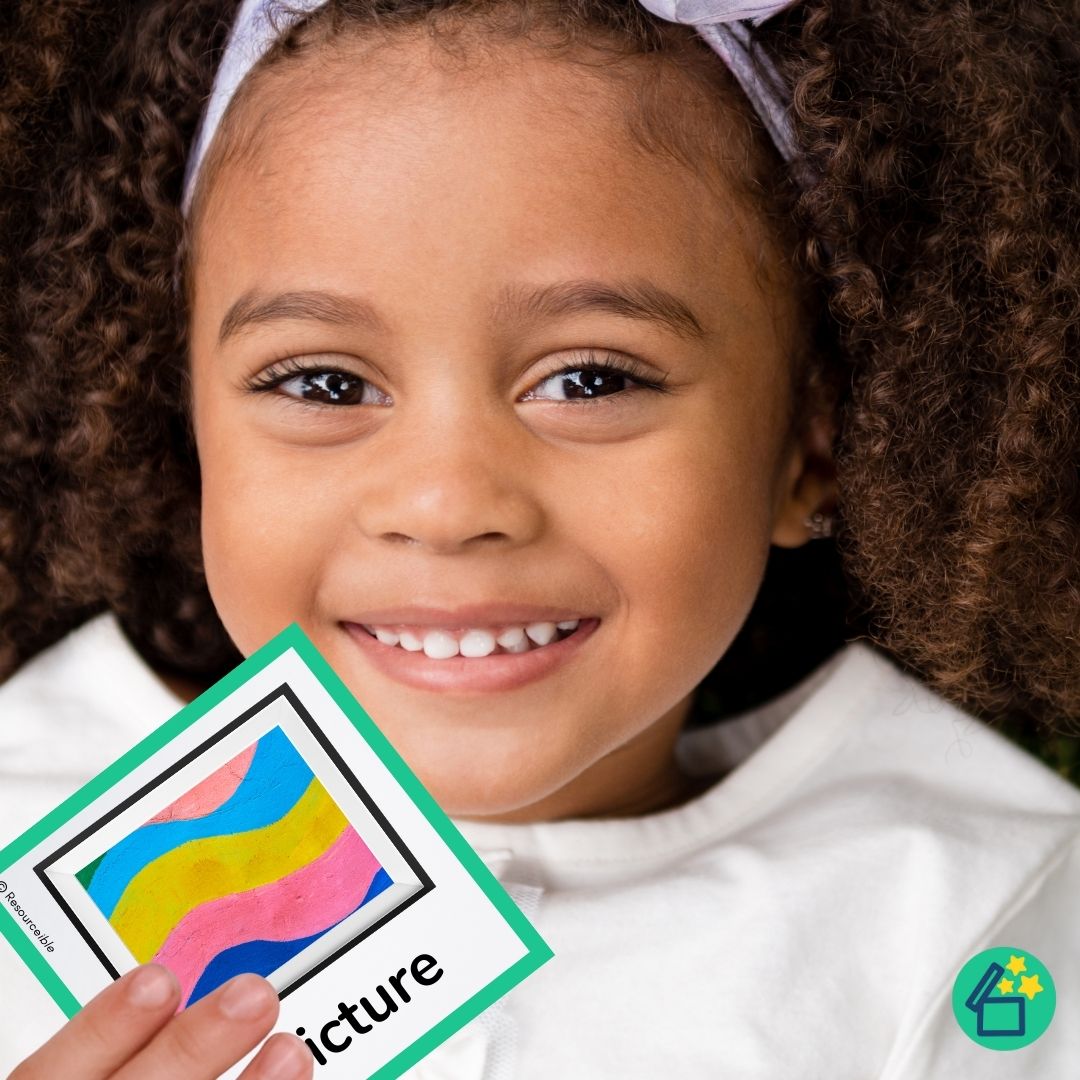 Happy little girl holding a ch word flashcard by Resourceible.